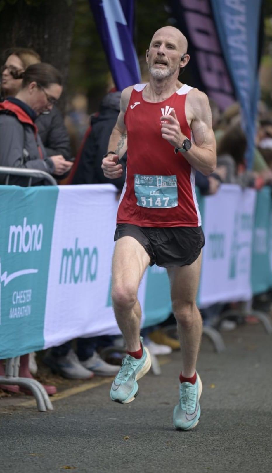 Lee Aherne, Parc Bryn Bach, finishing the Chester Marathon in second place to secure medals at all four Master Road Internationals this year.